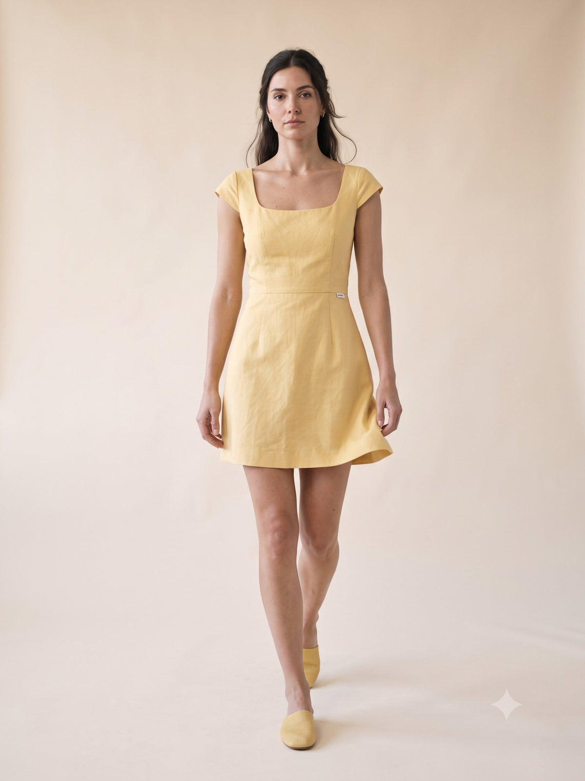 Kindle Faille Bow-Back Mini in Butter, in motion