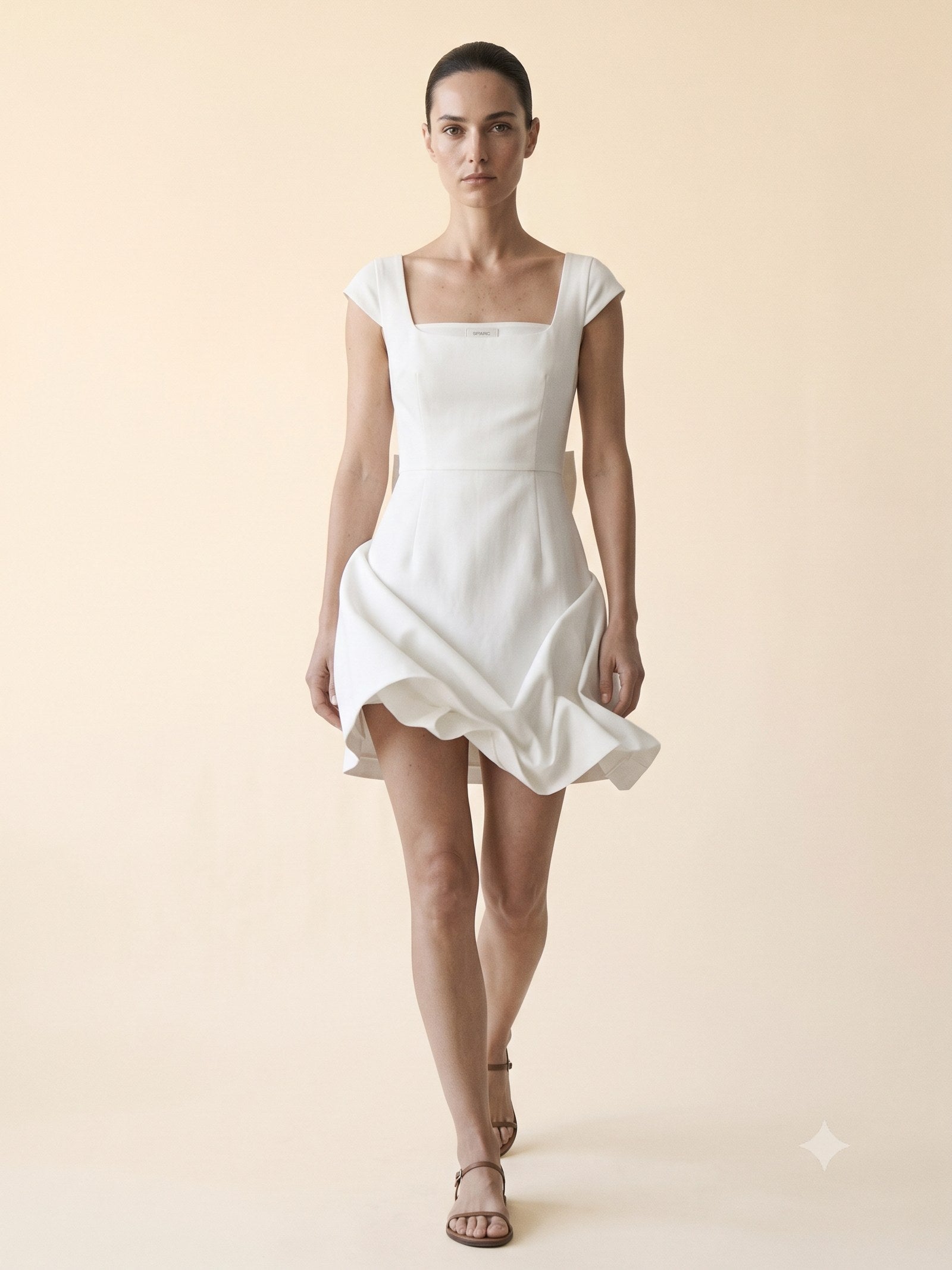Kindle Faille Bow-Back Mini in Chalk, in motion